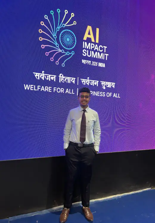 Arav standing in front of the India AI Impact Summit 2026 screen in New Delhi